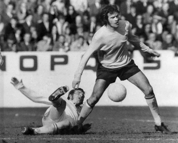 Framed Print : Arsenal v. Stoke. Arsenals hero Peter Storey is tacked by Stoke defender