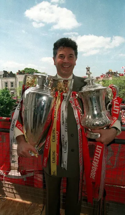 Framed Print : Arsenal vice chairman David Dein with the FA Cup and League Trophy, May 1998
