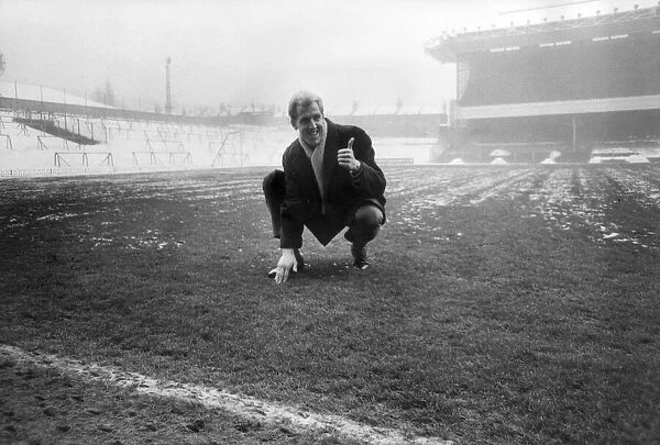 Arsenals Ian Ure inspecting the pitch at Highbury. 12th January 1968