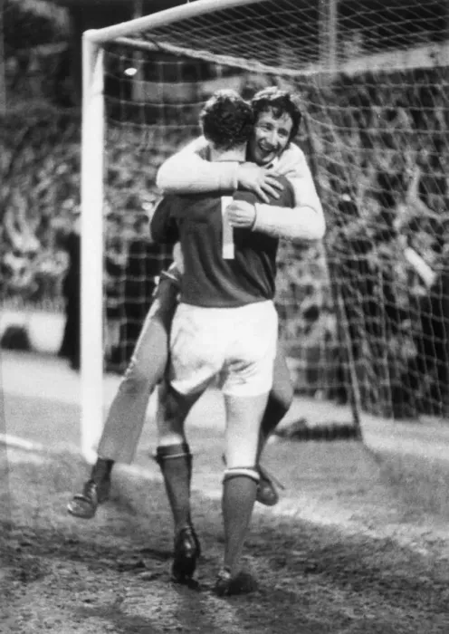Framed Print : Arsenl win the League championship, an excited fan hugs Bob Wilson. 4th May 1971 Framed Print : Arsenl win the League championship, an excited fan hugs Bob Wilson. 4th May 1971