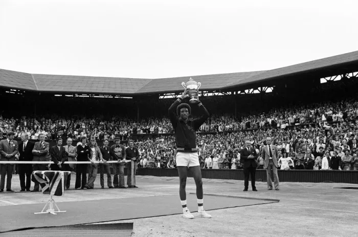 Framed Print : Arthur Ashe with the Wimbledon trophy after he beat the defending champion Jimmy Connors Framed Print : Arthur Ashe with the Wimbledon trophy after he beat the defending champion Jimmy Connors
