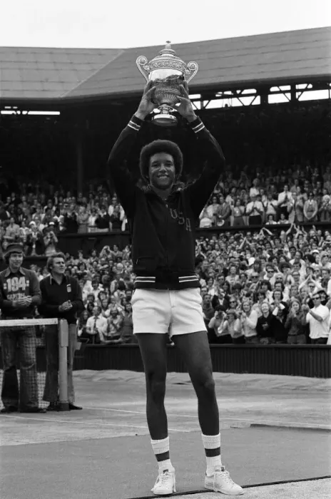 Framed Print : Arthur Ashe with the Wimbledon trophy after he beat the defending champion Jimmy Connors Framed Print : Arthur Ashe with the Wimbledon trophy after he beat the defending champion Jimmy Connors
