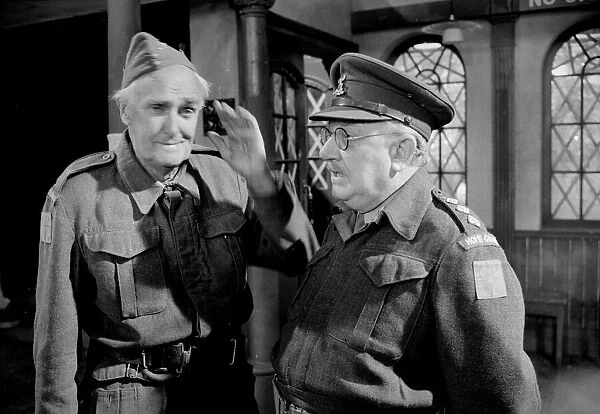 Arthur Lowe who plays Captain Mainwaring (right) and John Laurie (Private Frazer