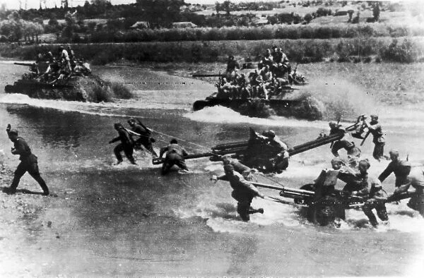 Artillery and tanks of the Russian Red Army force a river crossing in the Soviet advance