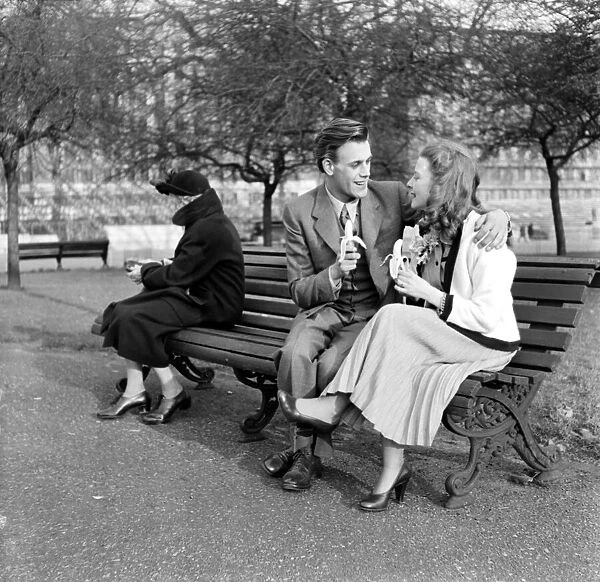Artist couple Richard and Pat Larter enjoy an ice cream on a park bench