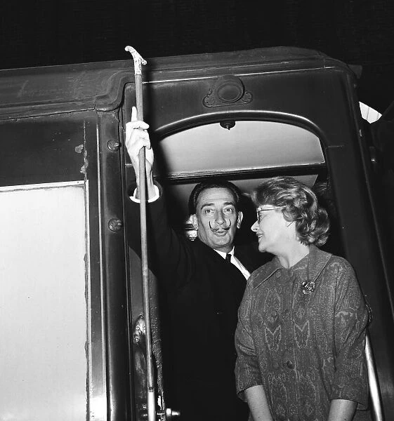 Artist Salvador Dali arrives in the UK, on the continental boat train to promote his