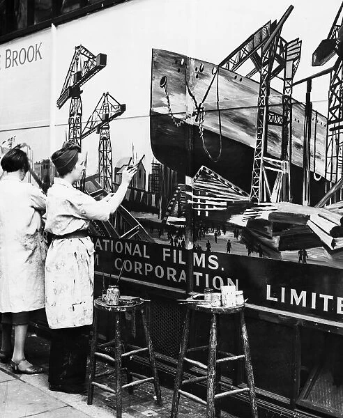 Artists painting a sign in Wardour Street during the Second World War
