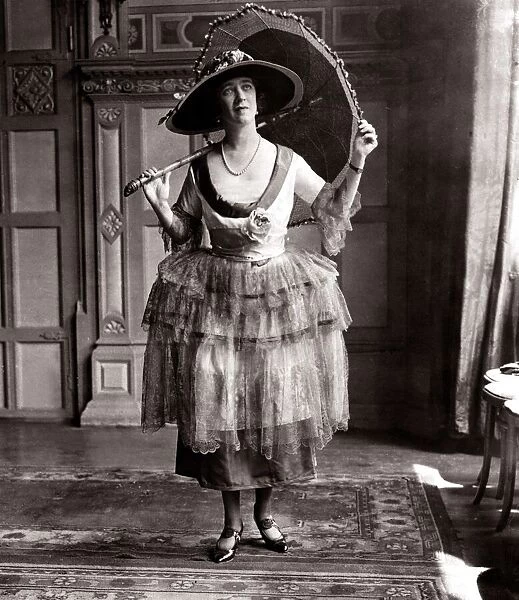 Ascot frock - June 1921 woman in dress holding a umbrella