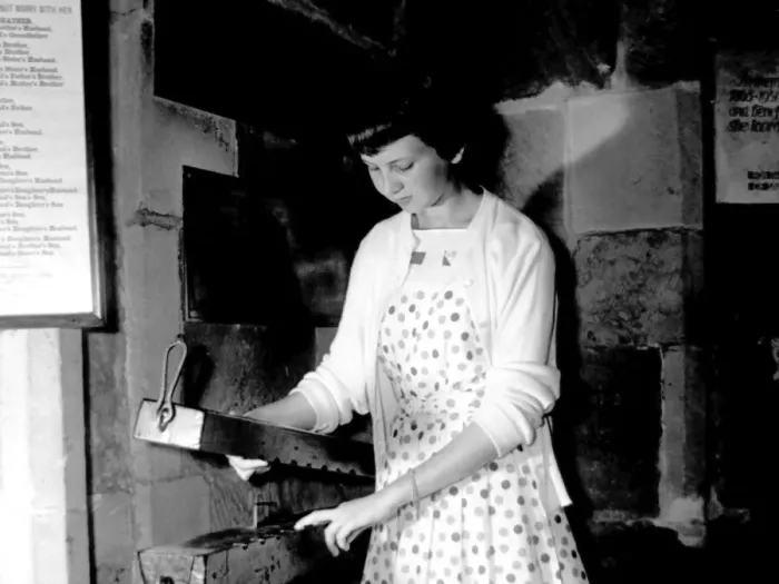 Framed Print : Ashbys unique finger pillory in the parish church, is tested by Christine Hill