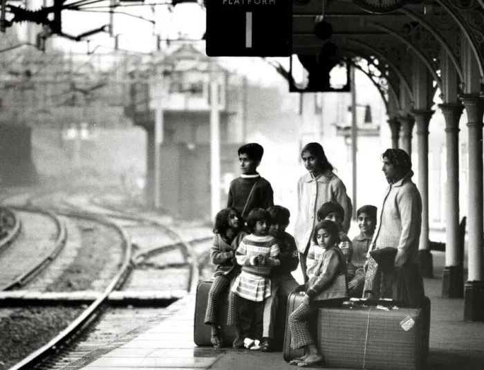 Framed Print : Asian immigrant family waiting at Bishops Stortford train station to travel to London Framed Print : Asian immigrant family waiting at Bishops Stortford train station to travel to London