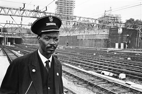 Asquith Xavier in his new job as a guard at Euston Station, London