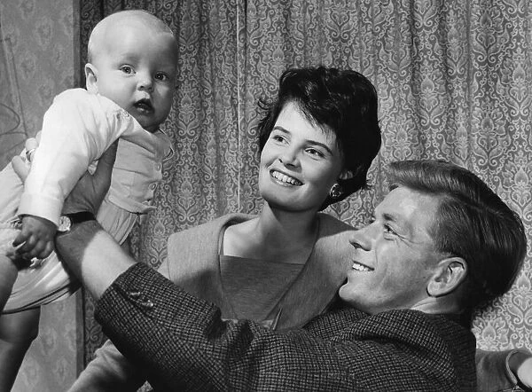 Aston Villa centre-forward Gerry Hitchens, with wife Meriol and their baby