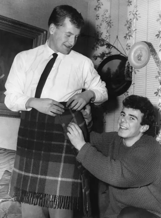 Framed Print : Aston Villa footballer Charlie Aitkens tries out a kilt. 30th December 1961 Framed Print : Aston Villa footballer Charlie Aitkens tries out a kilt. 30th December 1961