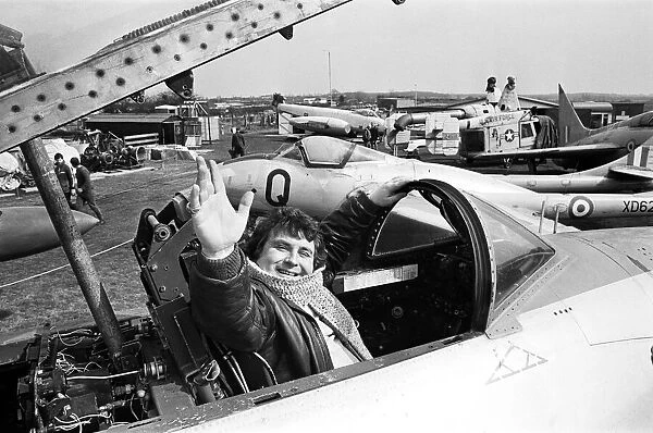 Astrologer Russell Grant poses in the cockpit of a Lockheed Shooting Star during his
