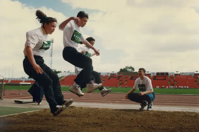Framed Print : Athlete Jonathan Edwards Jonathan Edwards teaches triple jump techniques to Framed Print : Athlete Jonathan Edwards Jonathan Edwards teaches triple jump techniques to