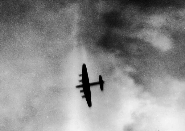 One of the attacking four engined Avro Lancaster bombers over the target area during