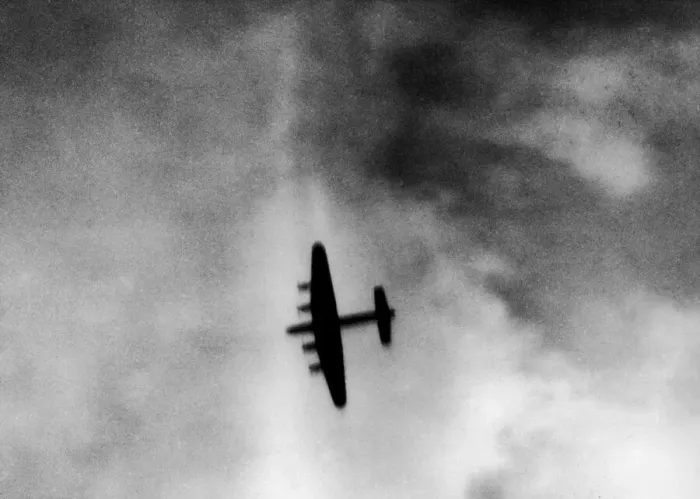 Framed Print : One of the attacking four engined Avro Lancaster bombers over the target area during Framed Print : One of the attacking four engined Avro Lancaster bombers over the target area during
