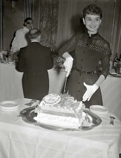 Audrey Hepburn May 1953 Film actress cuts into her Welcome home cake