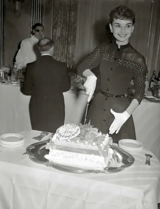 Framed Print : Audrey Hepburn May 1953 Film actress cuts into her Welcome home cake