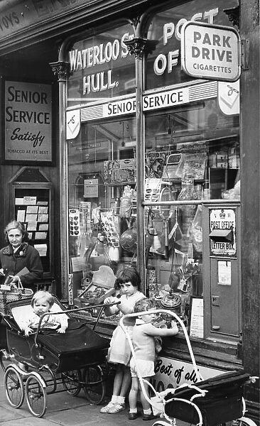August 1961. Children wait outside the Post Office in Waterloo Street, Hull