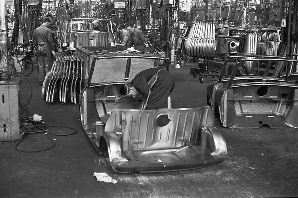 Austin Mini body panels are assembled prior to welding and being placed on the production