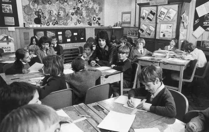 Framed Print : Australian pop star Rick Springfield joins youngsters at his old school in Woking. 1972