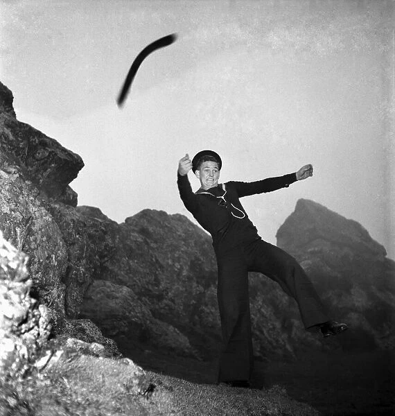Australian Sailor Eddie Cook is a keen boomerang thrower. November 1952 C5624-001