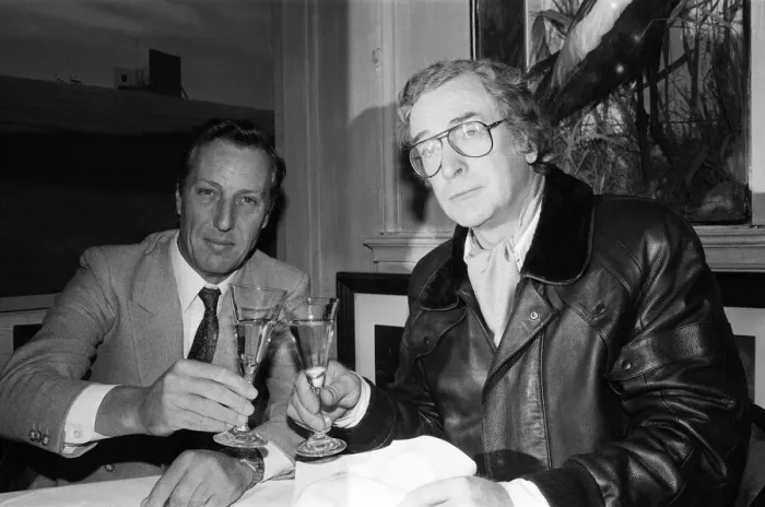 Framed Print : Author Frederick Forsyth having lunch with Michael Caine who starred in the film version Framed Print : Author Frederick Forsyth having lunch with Michael Caine who starred in the film version