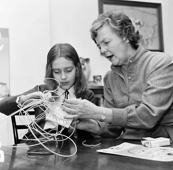 Author Jessica Mitford, basket weaving with the help of Amy Jenkins 30th November 1974