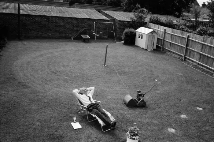 Framed Print : Automatic grass cutting. BOAC pilot Pat Alley demonstrating his mowing method in his Framed Print : Automatic grass cutting. BOAC pilot Pat Alley demonstrating his mowing method in his