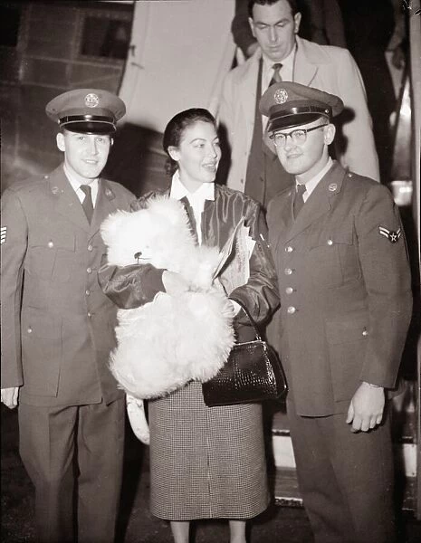 Ava Gardner arriving at London Airport talking to a pilot December 1954