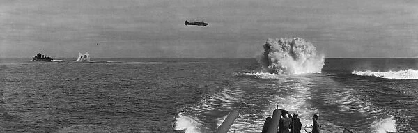 A Avro Anson of Coastal Command working in cooperation with two convoy escorts hunt down