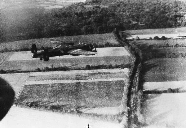 A Avro Lancaster B Mk I of No. 5 Group, flying at low-level over the French countryside