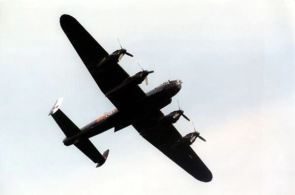 An Avro Lancaster bomber aircraft of the Battle of Britain Memorial Flight flies past
