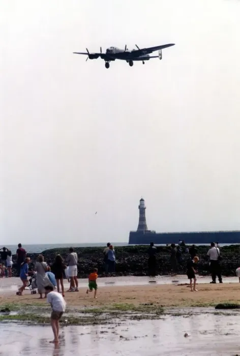 Framed Print : An Avro Lancaster bomber aircraft of the Battle of Britain Memorial Flight flies past