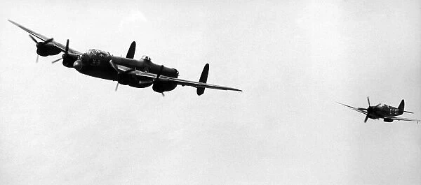 An Avro Lancaster bomber and Spitfire fighter plane of the Royal Air Force in flight