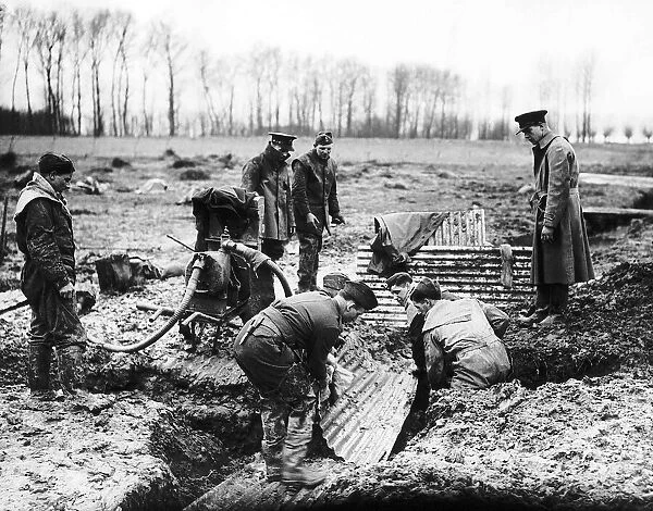 B Company Royal Irish Fusiliers constructing trenches with corrigated iron