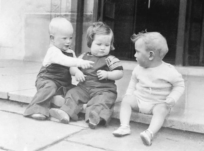 Framed Print : Three babies sitting on a front doorstep. Circa 1950 Framed Print : Three babies sitting on a front doorstep. Circa 1950