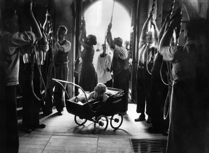 Framed Print : Baby in the belfry. Sitting happily in his pram, watching the efforts of his mummie Framed Print : Baby in the belfry. Sitting happily in his pram, watching the efforts of his mummie
