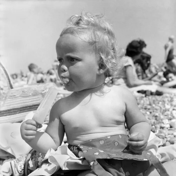 Framed Print : Baby and Lolly. Derorah Ann Clowes 13 months from Stoke on treat enjoys herself in