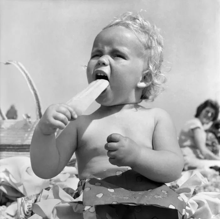 Framed Print : Baby and Lolly. Derorah Ann Clowes 13 months from Stoke on treat enjoys herself in