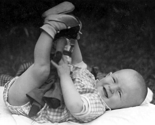 Baby lying outside in the garden. c. 1945 P044495
