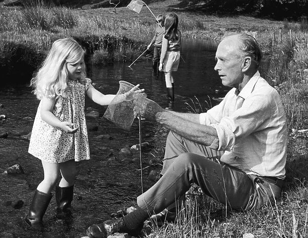 Bagging a brace of tiddlers with his grand daughter Clare is Sir Alec Douglas Home