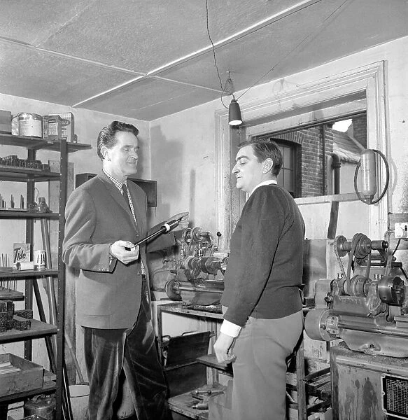 Bagpipe maker Mr. George Alexander seen here in his workshop. Circa 1960