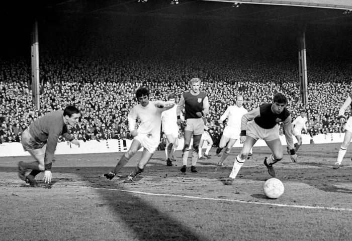 Framed Print : The ball comes across the box for Manchester United star George Best to score his sides