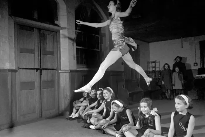 Framed Print : Ballet dancer Maureen Gardner gives instructions to children during one of her classes