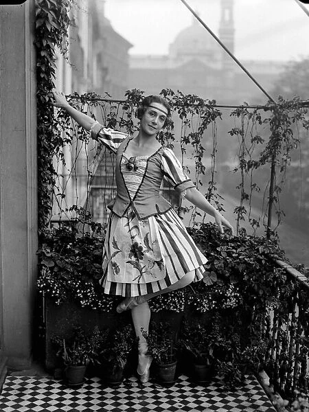 Ballet dancer Tamara Karsavina in costume warms up on the balcony of her London apartment