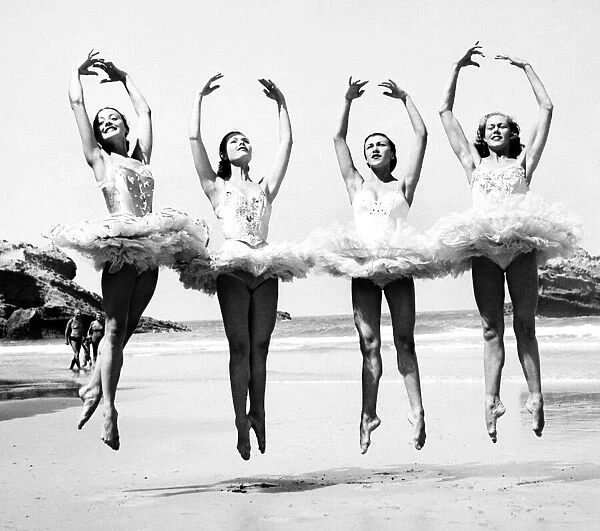 Ballet dancers entertain holidaymakers on a south coast beach. September 1953