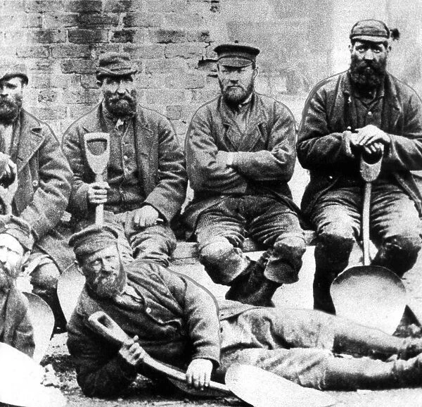 A band of coal trimmers in about 1880. Their job was to level the coal on boats