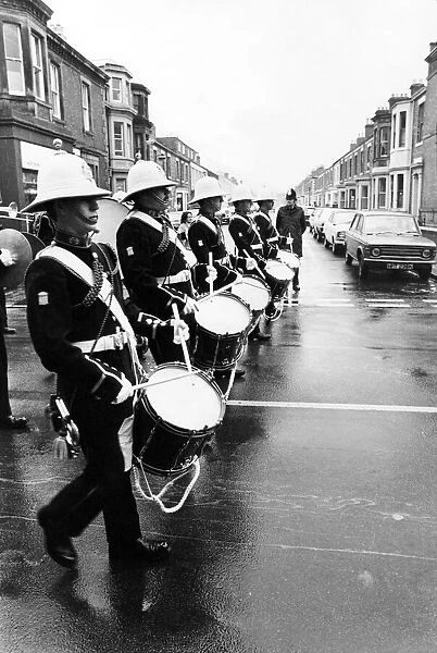 The band of the Royal Marines leading the parade through a deluge to Blyth Market Square